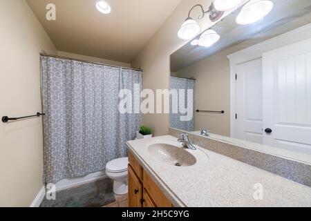 Small bathroom interior with two entrance white doors Stock Photo