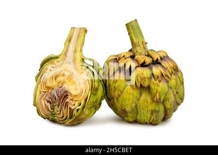 Whole and half artichoke on isolated white background Stock Photo