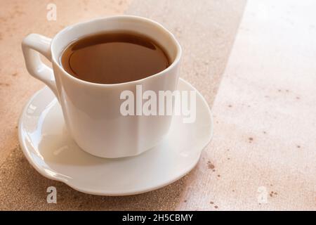 Cup of coffee on table Stock Photo