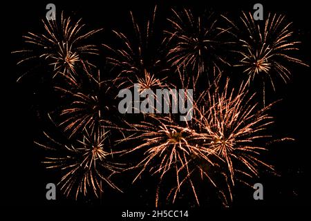 Golden fireworks on black sky background. Bonfire night, new year or other holiday Stock Photo