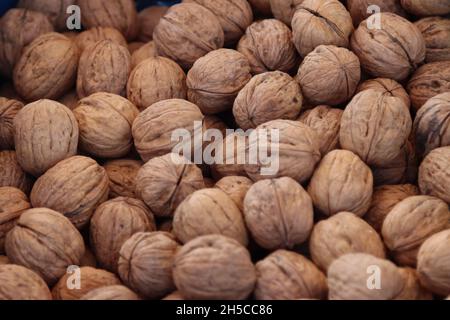 Close up shot of many of tasty walnuts in the walnut box exposed for sale Stock Photo