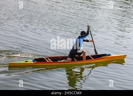 Man in rowing in canoe on the river. The hobby of active man is water sports. Travel photo, selective focus, copy space for text, concept photo active Stock Photo