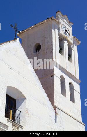 Beautiful Frigiliana village, SpainThe old church in the town square  View of the historic building and it's bell tower  Vertical shot with copy space Stock Photo