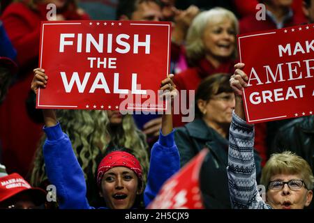 11052018 - Fort Wayne, Indiana, USA: Supporters hold signs as United States President Donald J. Trump campaigns for Indiana congressional candidates, including Mike Braun, who is running for senate, during a Make America Great Again! rally at the Allen County War Memorial Coliseum in Fort Wayne, Indiana. Stock Photo