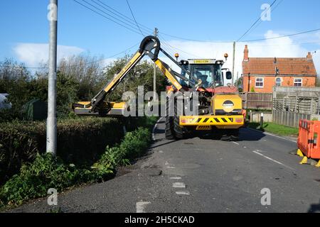 Verge and Hedge Cutting tractor Stock Photo - Alamy