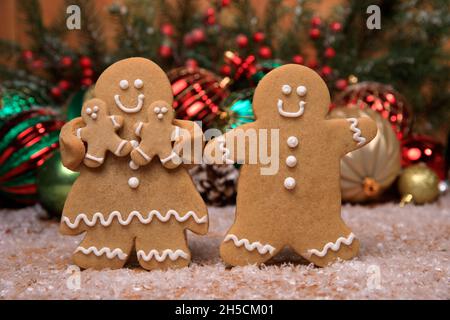 Gingerbread Family of 2 kids on Holiday Christmas Background Stock Photo