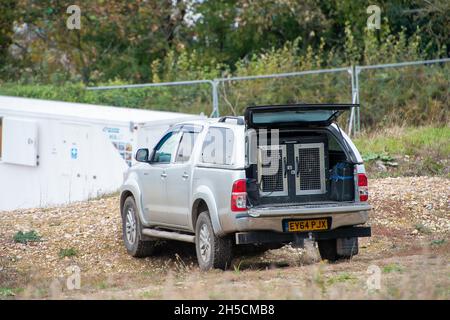 Aylesbury Vale, UK. 8th November, 2021. HS2 guard dogs barking as they are locked in cages in an HS2 security van at the Jones Hill Wood compound. HS2 now regularly use guard dogs at their compounds to try to intimidate protesters. Credit: Maureen McLean/Alamy Live News Stock Photo