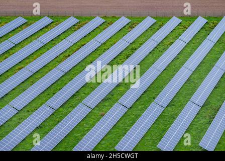 solar array on a meadow, Germany, Schleswig-Holstein Stock Photo