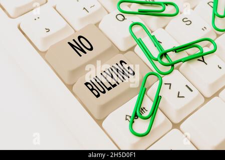 Sign displaying No Bullying. Word for stop aggressive behavior among children power imbalance Abstract Programmer Typing Antivirus Codes, Retyping Stock Photo