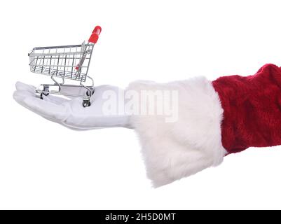 Closeup of Santa Claus holding an empty shopping cart in his hand. On-line holiday shopping concept. Hand and sleeve only. Stock Photo