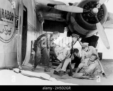 George Kennedy, Peter Finch, Christian Marquand, James Stewart, Ronald Fraser, on-set of the Film, 'The Flight of the Phoenix', 20th Century Fox, 1965 Stock Photo