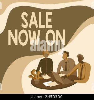 Sign displaying Sale Now On. Word for Discounts and promotional sales retail marketing offer Colleagues Drawing Sitting On A Desk With Laptop Having Stock Photo