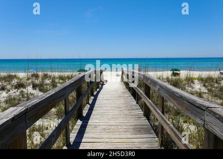 Beautiful view of a wooden path going to Henderson Beach State Park Destin in the USA Stock Photo