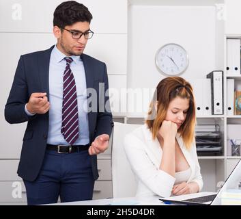 Manager scolding frustrated female Stock Photo