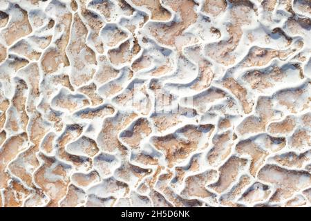 Textured background of abstract shape limestone deposits of travertine Pamukkale. Top view. Stock Photo