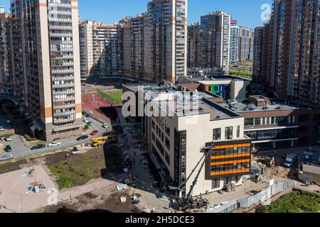 St. Petersburg, Russia - July 12, 2021: View of the new multi-storey buildings and the construction of a school in the Primorsky district of St. Peter Stock Photo
