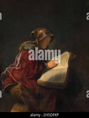 Netherlands: 'An Old Woman Reading, Probably the Prophetess Hannah'. Oil on oak wood painting by Rembrandt (15 July 1606 - 4 October 1669), 1631.  According to Christian legend, Mary and Joseph took their new son, Jesus, to the Temple in Jerusalem where two people immediately recognized him as the Messiah, the son of God. One was an old man called Simeon; the other was a pious old woman named Anna.  In the Middle Ages, Anna was often included in portrayals of the presentation at the Temple or the Circumcision. Here, Rembrandt van Rijn show St. Anna reading a Hebrew bible. Stock Photo