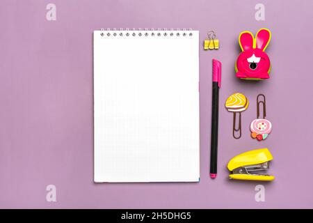 Stationary, back to school, summer time, creativity and education concept School supplies - magnifier, pencils, pen, paper clips, stapler and notepad Stock Photo