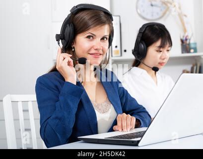 Operators working with computers in an office Stock Photo