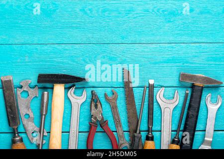 Happy Labor day concept Construction group home tools - hammer, saw, screwdriver, meter, pliers, wrench, chisel on blue wooden background Stock Photo