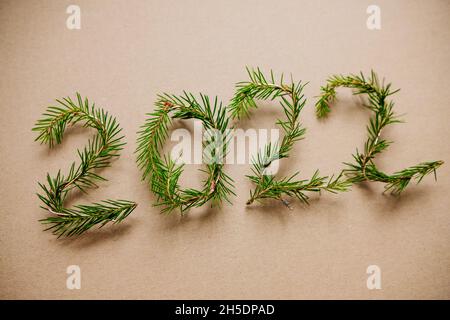 Lightbox with 2022 numbers handmade from Christmas tree branches. Stock Photo