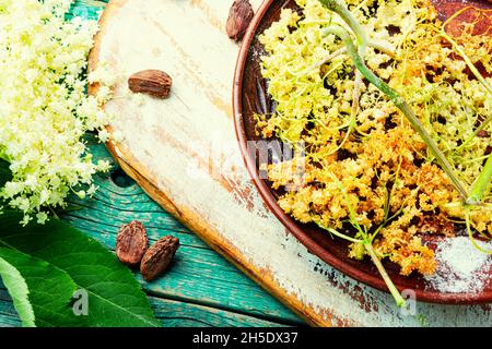 Fried elderflower in batter with powdered sugar. Spring flower dessert Stock Photo