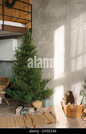 Christmas tree without toys in the Scandinavian-style living room interior Stock Photo