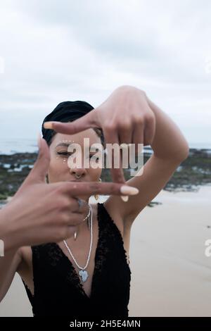 Portrait of woman making a gesture with her hand Stock Photo
