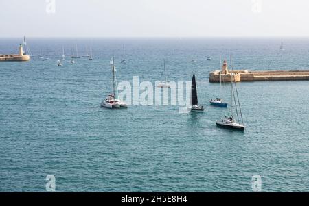 VALLETTA, MALTA - Oct 23,2021: panoramic view of the Rolex Middle Sea Yacht Race from shore of Grand Harbour, Malta, Mediterranea.Sailing boat racing. Stock Photo