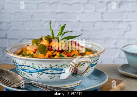 Succotash - Southern American dish with vegetables, butter beans,  butternut squash, sweetcorn and chorizo Stock Photo