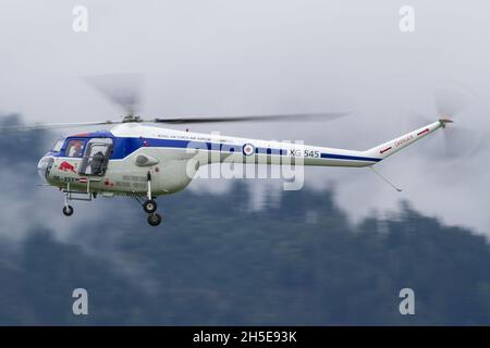 ZELTWE, AUSTRIA - Sep 07, 2019: Bristol 171 Sycamore oldtimer helicopter in flight at Airport 2019 in Zeltweg Stock Photo