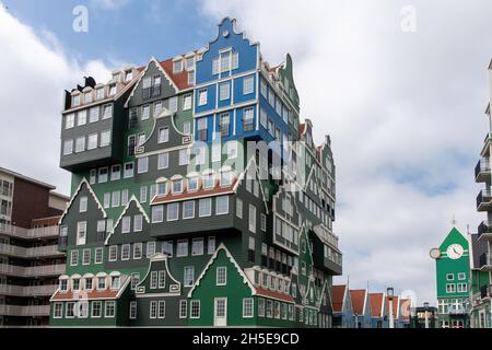 Zaandam, The Netherlands-June 2021; Low angle view of the facade of a hotel that looks like a build up of traditional houses from the region on top of Stock Photo