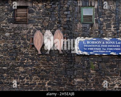 The blackened walls of the L Robson & Sons Kipper smokehouse - Tucked away in the centre of Craster is this world famous smoke house. Stock Photo