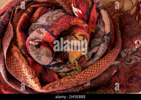 textured scarf on wooden background with space for your text or product Stock Photo