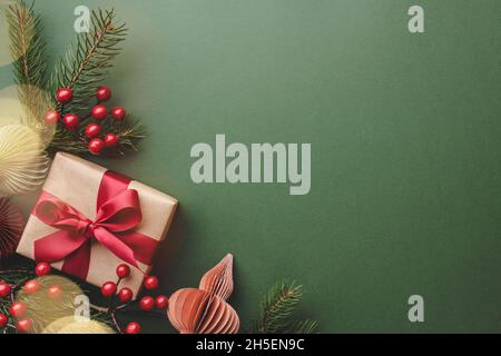 Christmas gift and decorations on green background. Stock Photo