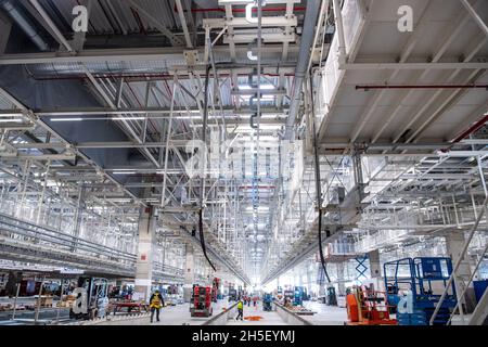 Emden, Germany. 09th Nov, 2021. Construction is underway in the new hall for the production of electric cars. The VW site in Emden is being developed into Lower Saxony's first plant for electric vehicles. Credit: Sina Schuldt/dpa/Alamy Live News