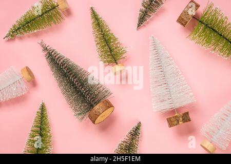 Christmas fir tree at pink background flat lay. Stock Photo