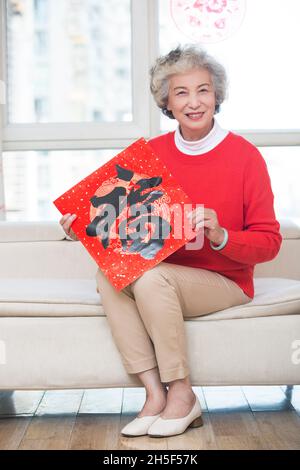 Happy grandma celebrating the New Year Stock Photo