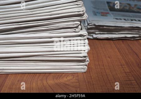 Stack of newspapers Stock Photo