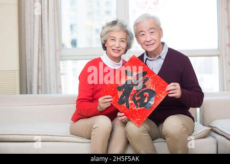 Happy grandma celebrating the New Year Stock Photo