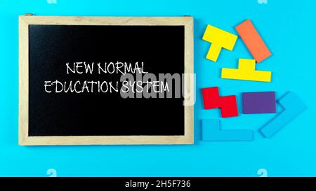 New normal education system on a blue background. Selective focus on a blackboard on a blue background Stock Photo