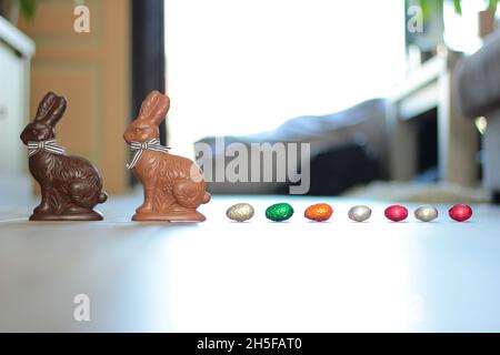 Chocolate bunnies and chocolate eggs on the floor Stock Photo