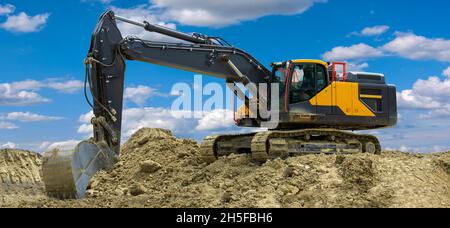 excavator at work on construction site Stock Photo