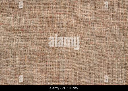 Beige sackcloth background, natural cloth backdrop, copy space Stock Photo