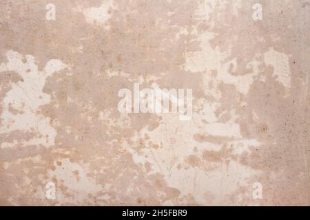 Beige plastered wall covered with fresh primer texture background Stock Photo