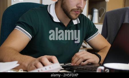 Business man doing exercise at the office. Office worker doing exercises the hands. During a hard working day office worker flexing his fingers. Stock Photo