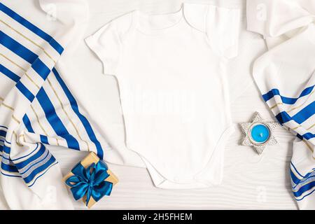 Jewish holiday Hanukkah baby bodysuit mock up with menorah and decor Stock Photo