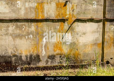 WA19757-00...WASHINGTON - Aging wall with cut electrical wire casing at Battery Randol at the old Fort Worden , now part of Fort Worden State Park Stock Photo
