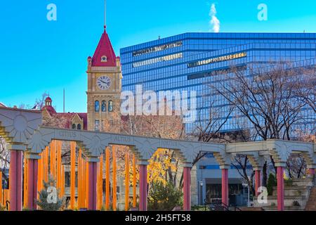 Heritage old City Hall Tower rises behind Olympic Plaza, Calgary, Alberta, Canada Stock Photo