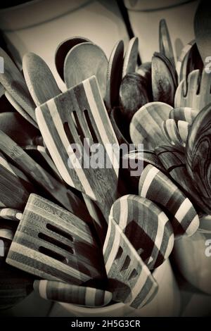Wooden spatulas, forks and spoons for sale in home good store in NYC Stock Photo